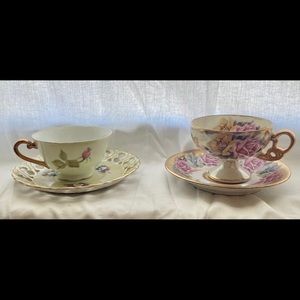 Two tea cups with saucers
